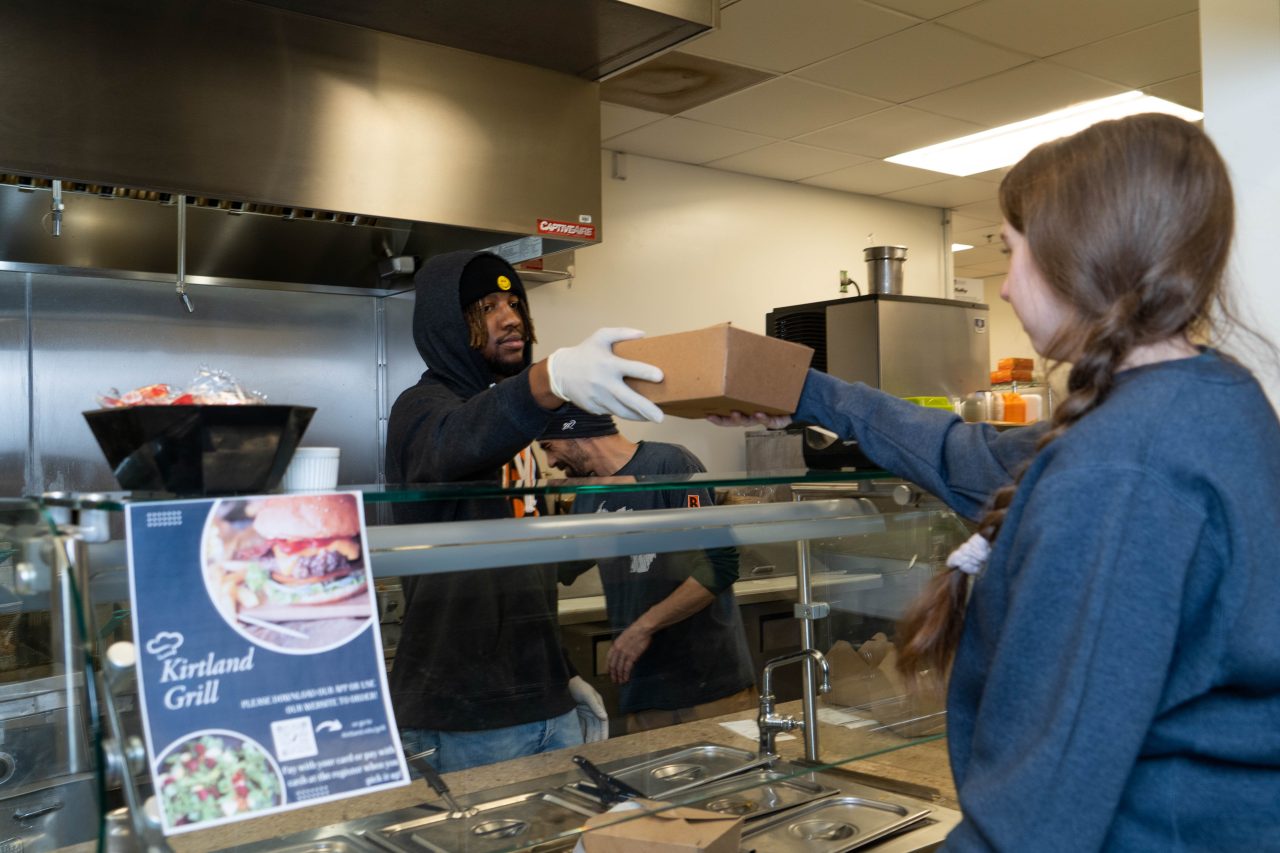 Student Picking Up Grill Order